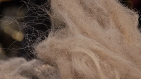 Creation of a thread from sheep wool and a spindle Stock Footage 103413496