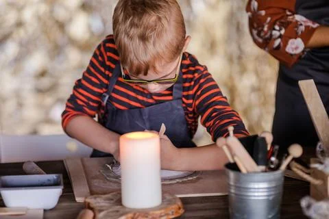 Creative 5-Year-Old Boy with Glasses Working on Handmade Ceramics Stock Photos