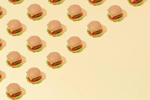 Creative abstract art burger pattern flat lay on pastel yellow background min Stock Photos