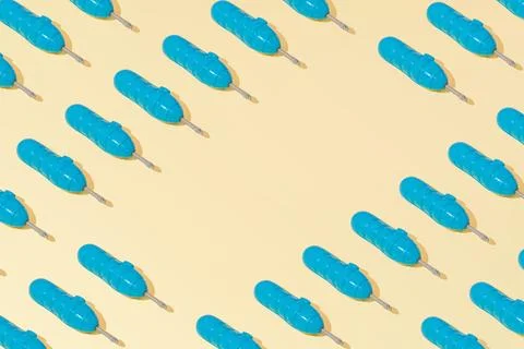 Creative abstract blue screwdriver tool pattern flat lay on yellow background Stock Photos