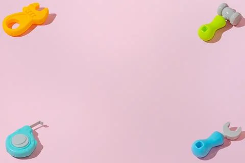 Creative abstract build tools pattern flat lay on pink background copy space 库存照片