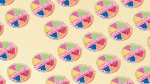 Creative abstract cosmetic makeup eye shadow pattern flat lay yellow background Stock Footage 331716587