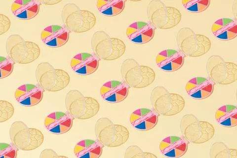 Creative abstract cosmetic makeup eye shadow pattern flat lay yellow backgrou Stock Photos