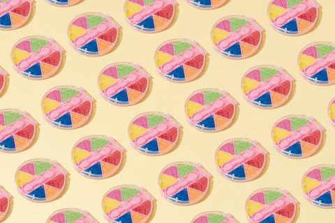 Creative abstract cosmetic makeup eye shadow pattern flat lay yellow backgrou Foto stock