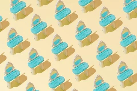 Creative abstract cosmetic makeup table pattern flat lay on yellow background Stock Photos