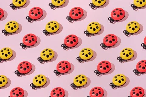 Creative abstract ladybug pattern flat lay on pastel pink background minimali Stock Photos