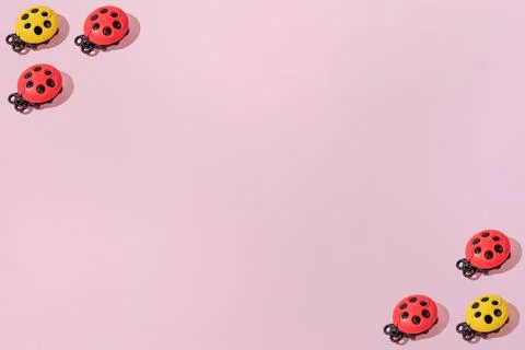 Creative abstract ladybug pattern flat lay on pastel pink background copy spa Stock Photos