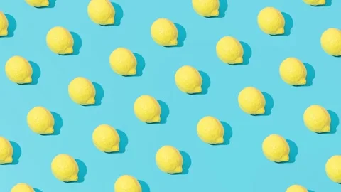 Creative abstract lemon pattern flat lay on pastel blue background minimalism Stock Footage 331715100