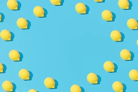 Creative abstract lemon pattern flat lay on pastel blue background copy space Foto stock