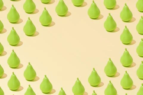 Creative abstract pear pattern flat lay on pastel yellow background copy spac Stock Photos