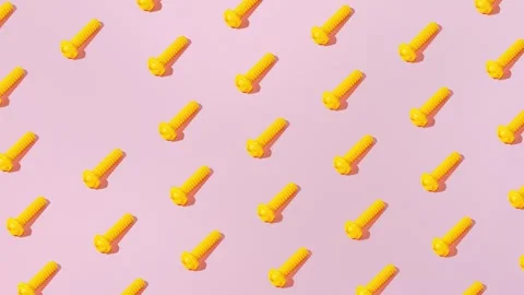 Creative abstract screw pattern flat lay on pastel pink background minimalism Stock Footage 331714138