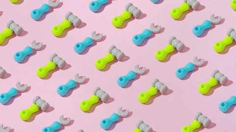 Creative abstract screwdriver and hammer tool pattern flat lay pink background Stock Footage 331713853