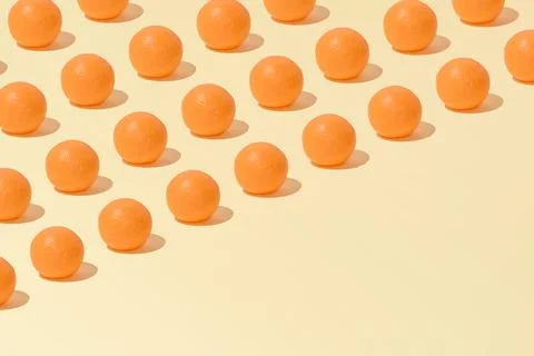 Creative abstract summer orange pattern flat lay on pastel yellow background  Stock Photos