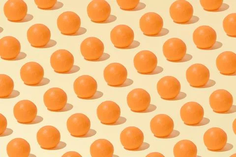 Creative abstract summer orange pattern flat lay on pastel yellow background  Stock Photos
