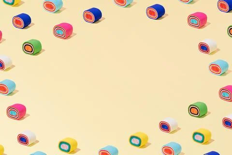 Creative abstract sushi roll pattern flat lay pastel yellow background copy.. Stock Photos