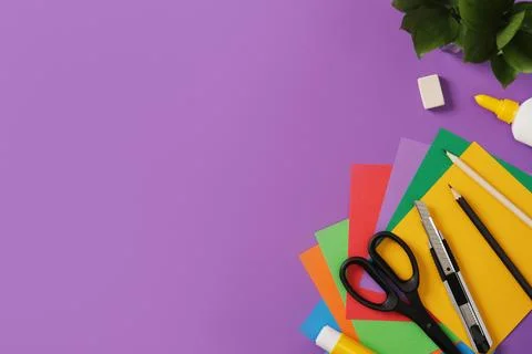 Creative accessories: scissors, craft knife, pencil, eraser, paper on purpl.. Stock Photos