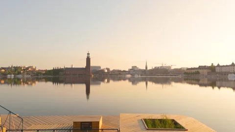 Creative aerial through heart frame on Stockholm promenade toward City Hall Video stock 279238773