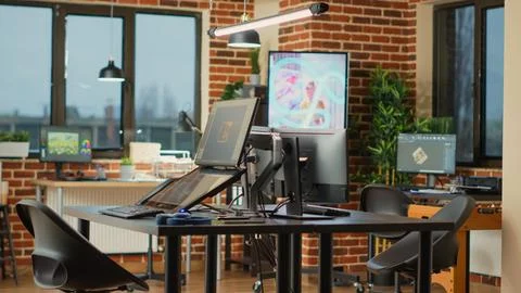Creative agency modern office with multiple monitors to work on professional Stock Photos