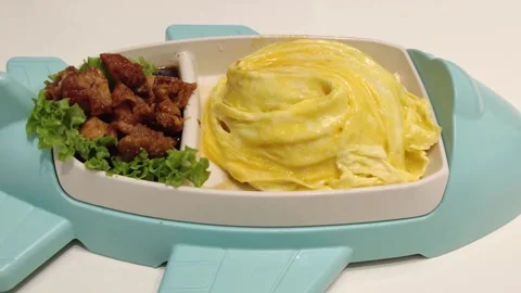 Creative airplane shaped plate serving Japanese style omelette rice 動画素材 320852913