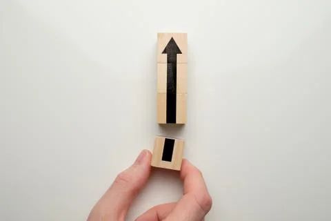 Creative and business development growth concept - hand holds wooden cube wit Foto stock