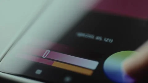 Creative app interface with vertical color and brightness sliders, picking a Stock Footage 327449665