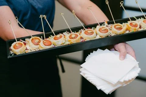 Creative appetizer display featuring unique sushi rolls served at a catering Stock Photos