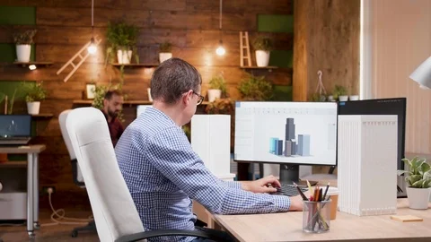 Creative architect in the office designing new skyscrapers Stock Footage 115072107