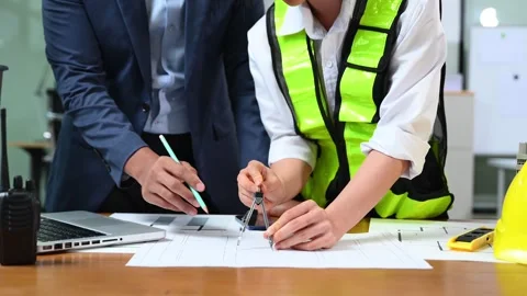 Creative architect projecting on the big drawings with architectural projec.. Stock Footage 312774955