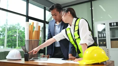 Creative architect projecting on the big drawings with architectural projec.. Stock Footage 312774996