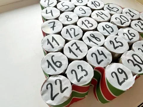 Creative arrangement numbered cylindrical objects forming a Christmas tree .. Stock Photos