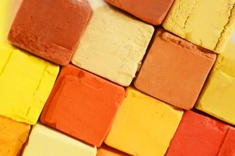 Creative art background - closeup of bright pastel crayons with yellow,orange Stock Photos