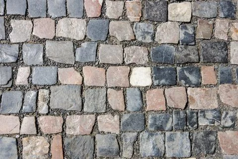 Creative art background of small granite tiles for street pavement Stock Photos