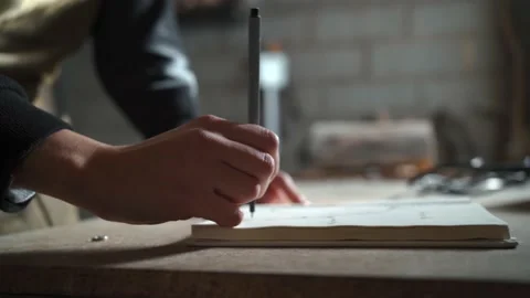 Creative artisan drawing sketch in notebook Stock Footage 167422884