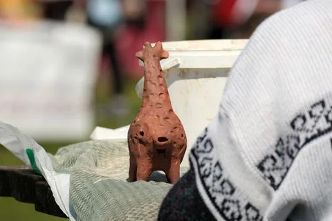 Creative artisans showcase handmade giraffe sculpture at craft fair Stock Photos
