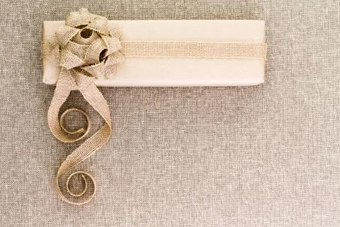 Creative artistic rustic Christmas gift on burlap Stock Photos