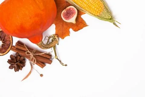 Creative autumn composition with pumpkin, figs and yellow leaves Stock Photos