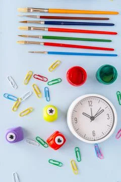 Creative back to school supplies flatlay with colorful markers paint brushe.. Stock Photos
