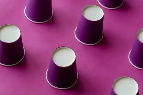 Creative background with Lilac paper cups for coffee. Stock Photos
