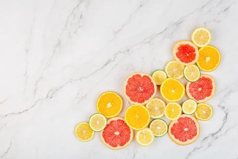Creative background made of summer tropical fruits with grapefruit, orange, t Stock Photos