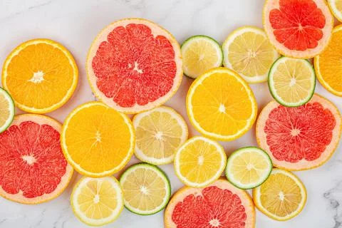 Creative background made of summer tropical fruits with grapefruit, orange, t Stock Photos