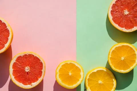 Creative background made of summer tropical fruits, grapefruit, orange, tange Stock Photos