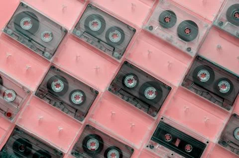 Creative background with old audio cassettes. Stock Photos