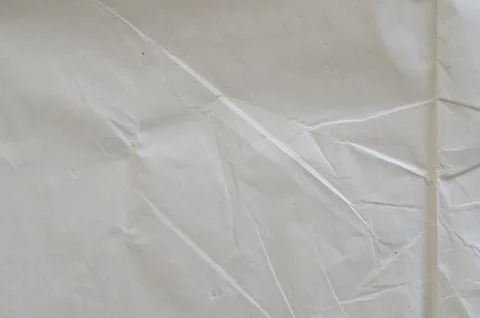 Creative background with scattered overlay of crumpled white paper. Stock Photos
