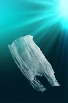 Creative background of single-use plastic bag floating in sea or ocean Stock Photos