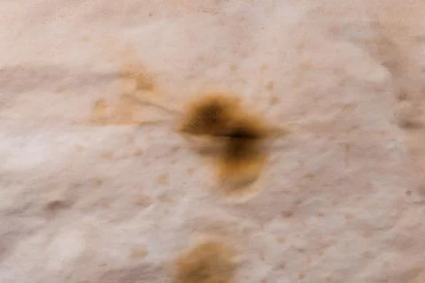 Creative background, a spot of  colored primer rubbed on the surface of a lin Foto stock