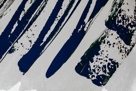 Creative background, a spot of  colored primer rubbed on the surface of a l.. Stock Photos