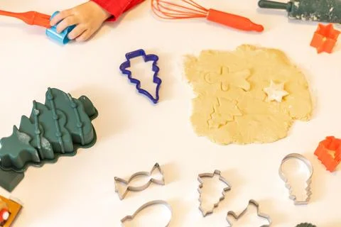 Creative baking session with cookie cutters in a cozy kitchen during holida.. Stock Photos