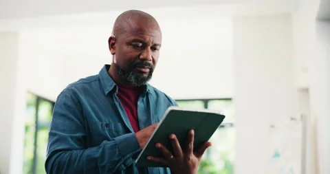 Creative, black man and reading with tablet in office for research, proofreading Video stock 323275777
