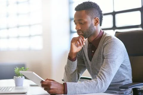 Creative, black man and technology on desk in office for work as web developer Stock Photos