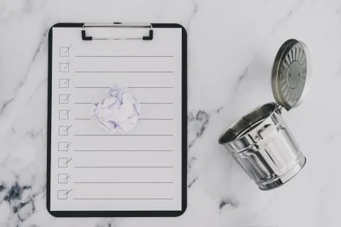 Creative block or burnout, to do list on clipboard with scrunched paper draft Stock Photos
